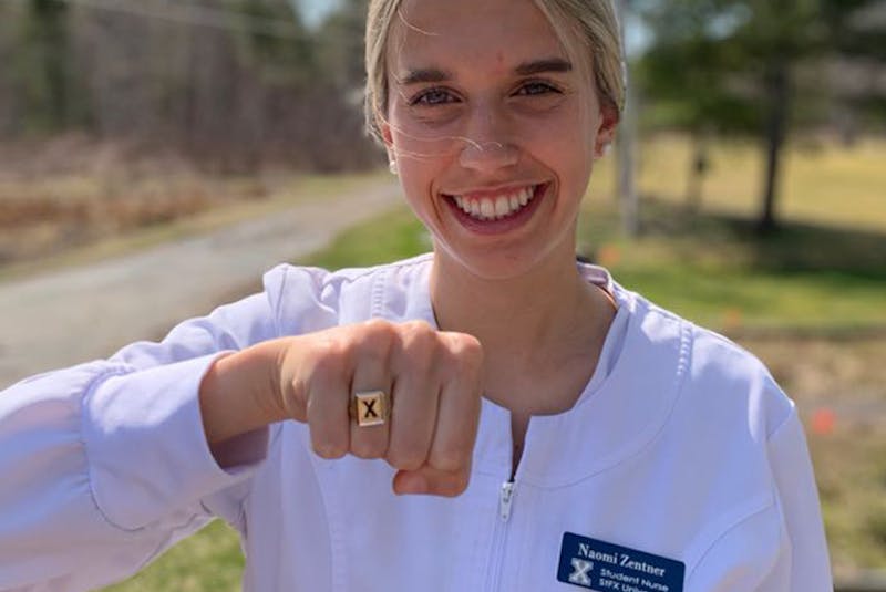 Naomi Zentner, Woodburn, displays her X ring and her St. FX scrubs prior to graduating from nursing this weekend. (Contributed photo)
 - Contributed