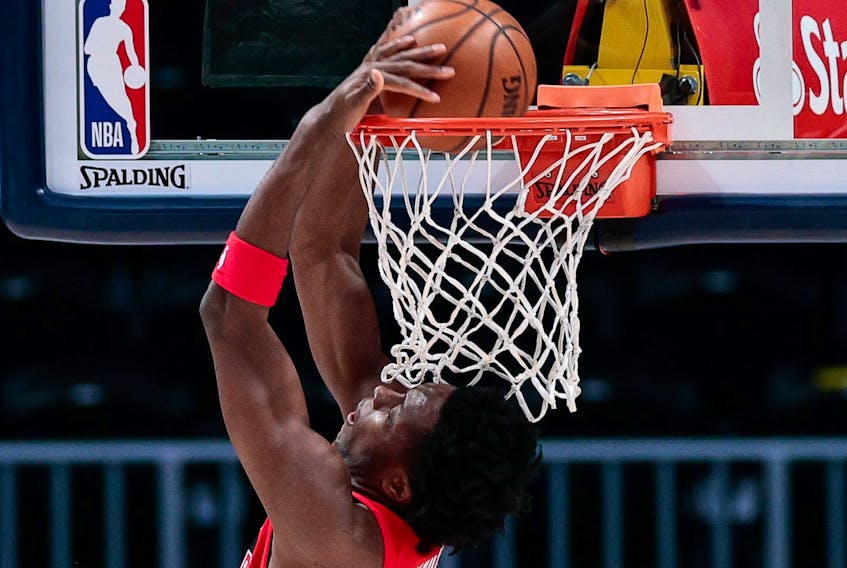 Raptors forward OG Anunoby (3) dunks the ball in the first quarter against the Denver Nuggets at Ball Arena. 
