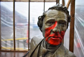 The Sir John A. Macdonald bench statue at the corner of Queen Street and Victoria Row in Charlottetown was subject to vandalism sometime late Thursday, April, 29 or in the early morning hours of Friday, April 30. A public works crew was at the site on Friday, April 28 sandblasting the paint off.