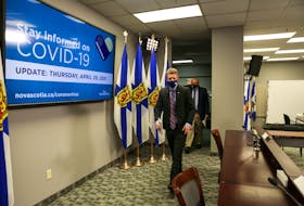 Nova Scotia Premier Iain Rankin and Dr. Robert Strang, Nova Scotia's chief medical officer of health, enter the room ahead of their COVID-19 briefing Thursday, April 29, 2021.