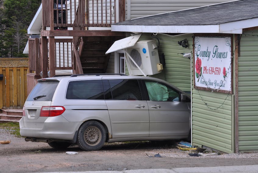 A minivan crashed through the exterior of Country Flowers on Country Road in Corner Brook early Friday morning, April 30, 2021. The minivan crashed into a light pole before hitting the flower shop.  
