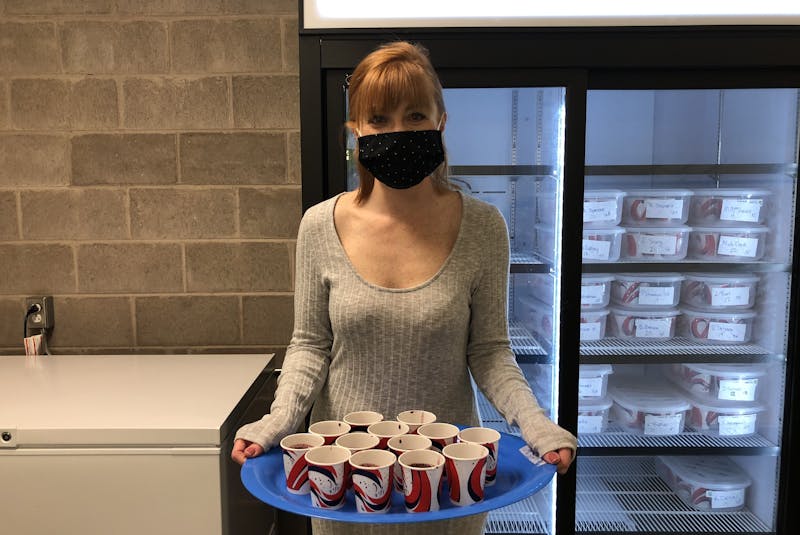 Krystyna Cahill, secretary of the home and school board, shows off the blueberry banana smoothies that were passed around to students on April 20. - Kristin Gardiner