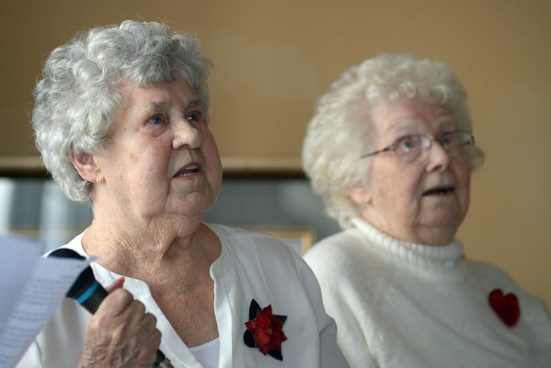Madeline O’Rourke (left) and Bride Martin sing along during an event at Alderwood Estates in Witless Bay Thursday to remember the men lost during the 1914 Newfoundland Sealing Disaster and other sealing tragedies. — Keith Gosse/The Telegram