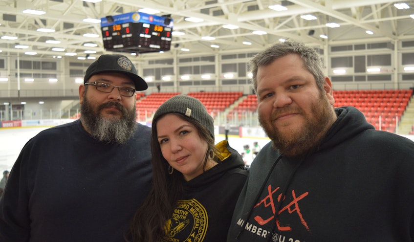 Brothers J.R. Isadore (left) and Michael Isadore (right), pictured with their sister Paulina Meader, co-organize the Wallace Bernard Native Youth Hockey Tournament in honour of their grandfather. They're disappointed to postpone the tournament for the second year in a row. FILE PHOTO - Oscar Baker