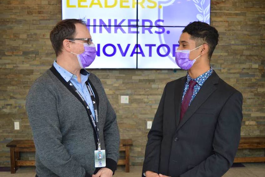 Jason Biech, left, head of school at Grace Christian School in Charlottetown, says Samuel Lowe, a Grade 12 student, overcame tremendous adversity to be named one of 30 students in Canada to receive a Loran Award, valued at $100,000 to each student.