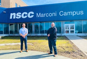 Michael Keating, left, and the principal of NSCC Marconi Campus Fred Tilley, stand outside the Nova Scotia Community College (NSCC) location on March 31. CONTRIBUTED