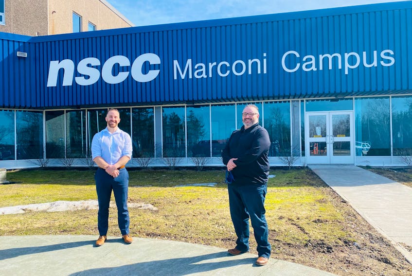 Michael Keating, left, and the principal of NSCC Marconi Campus Fred Tilley, stand outside the Nova Scotia Community College (NSCC) location on March 31. CONTRIBUTED