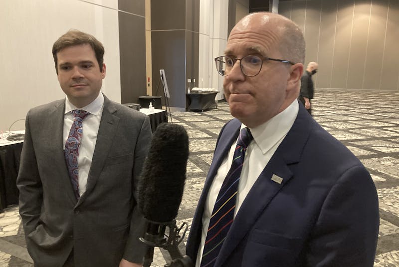 Gavin MacDonald and Patrick Sullivan of the Halifax Chamber of Commerce talk about Premier Iain Rankin's state-of-the-province address at the Halifax convention centre Wednesday, April 7, 2021. - Francis Campbell