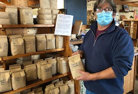 Brett Bunston says sales of his freshly-roasted coffee beans have taken off at his shop, the Caledonia House, at the Charlottetown Farmers' Market since the COVID-19 pandemic. On the flip side, single-cup sales have drastically fallen off.