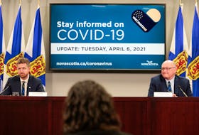 Nova Scotia Premier Iain Rankin, left, and chief medical officer of health Dr. Robert Strang attend a health briefing in this file photo.