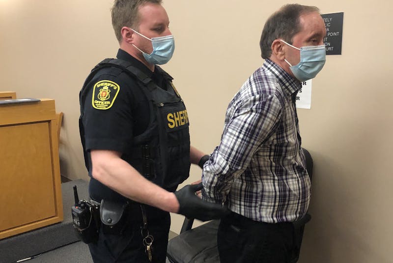 A sheriff’s officer escorts Edwin James Smith from the courtroom during a recess at provincial court in St. John’s.  - Tara Bradbury