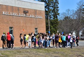 Students walked out of West Kings District High School in Auburn on Thursday afternoon in support of a female student who says she was suspended after bringing to light a shirt a male student was wearing which included the words 'Tis the season to be rapey." - Ashley Thompson