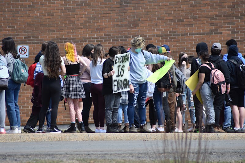 Students walked out of West Kings District High School in Auburn on Thursday afternoon in support of a female student who says she was suspended after bringing to light a shirt a male student was wearing which read 