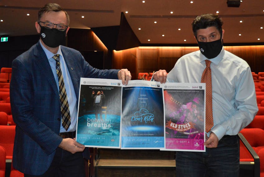 Steve Bellamy, left, CEO of the Confederation Centre of the Arts, and Adam Brazier, artistic director of the Charlottetown Festival, display posters for the three shows that will be featured on stage in the Homburg Theatre. The shows are, from left, Between Breaths, Dear Rita and Old Stock: A Refugee Love Story.