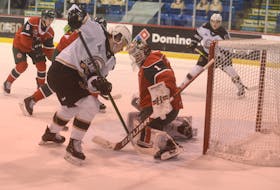 Halifax Mooseheads goalie Alexis Gravel makes a skate save on Charlottetown Islanders winger Thomas Casey Wednesday during Quebec Major Junior Hockey league game at the Eastlink Centre in Charlottetown.