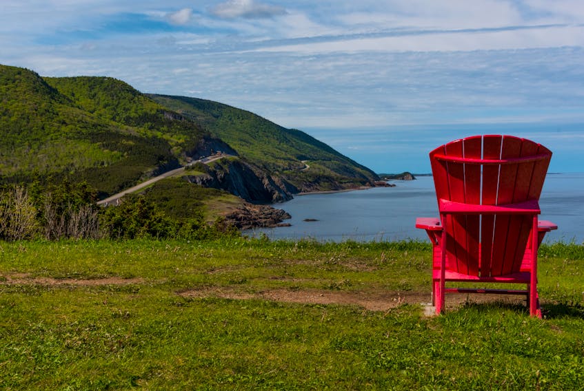 An adirondack chair at the coast in Petit Étang, Cape Breton Highlands National Park. STOCK