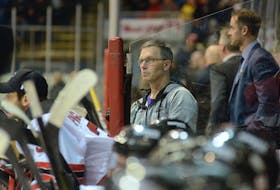 Charlottetown Islanders athletic therapist Kevin Elliott follows the play during a Quebec Major Junior Hockey League game at Eastlink Centre. 