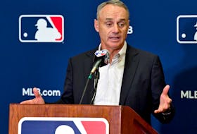 MLB commissioner Rob Manfred answers questions from the media during spring training media day in Arizona. 

