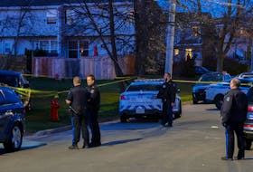 Halifax regional police work on Lahey Road at Clarence Street as they investigate reports of a shooting in Dartmouth, Thursday evening, April 8, 2021.