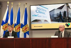 Nova Scotia Premier Iain Rankin and Dr. Robert Strang, chief medical officer of health, hold a COVID-19 briefing Friday, April 9, 2021, in Halifax.