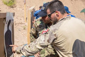 This 2019 file photo shows a Canadian Forces member at a U.S. base near Mosul teaching combat skills to Iraqi Wide Area Security Forces. 