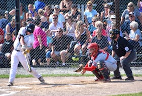 Blair Clowes of the Confederation Park Trappers of Alberta, left, fouls off a pitch as catcher Bryden Gardiner of the Cape Breton Ramblers and umpire George Long watch during Canadian Senior Little League Championship action at the Nicole Meaney Memorial Ball Park in Sydney Mines in July 2019. Little League Canada announced the cancellation of the 2021 tournament in Sydney Mines due to the COVID-19 pandemic. JEREMY FRASER • CAPE BRETON POST