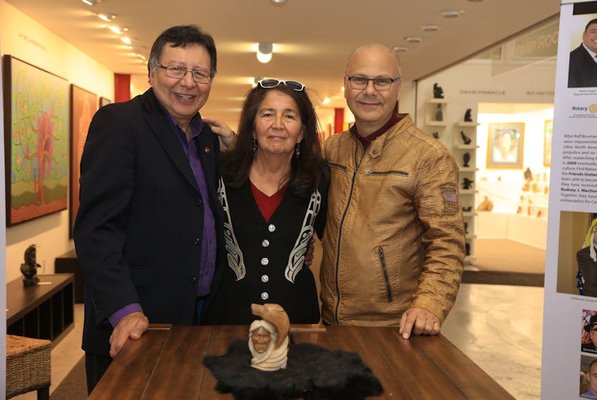 Senator Dan Christmas and his late wife, Dozay Christmas, with Rolf Bouman of Friends United in 2019 at the gallery's opening of her art exhibit. CONTRIBUTED