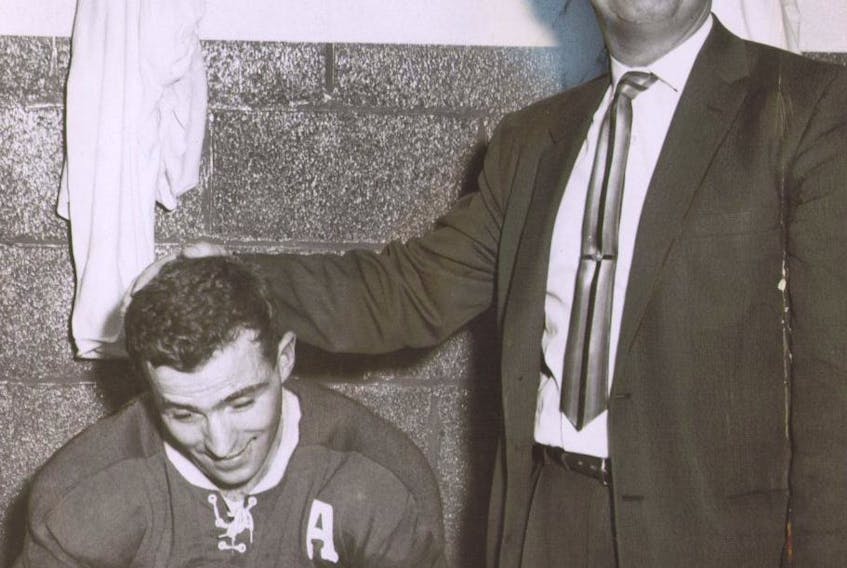  Leafs coach and general manager Punch Imlach congratulates Dick Duff after his overtime goal gave Toronto its only win of the 1959 Stanley Cup final against Montreal. SUN FILES
