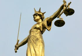 FILE PHOTO: A statue representing the scales of justice.