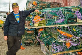 Fisher George Fraser helps prepare the lobster traps in South Bar on Friday afternoon for early Saturday morning, the start of the lobster season in Area 27. JESSICA SMITH/CAPE BRETON POST