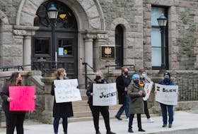 About two-dozen folks gathered outside the Supreme Court of Newfoundland and Labrador building on Duckworth Street in downtown St. John’s on Saturday morning in rally of the “supportforJaneDoe” movement to support the victim of a 2014 sexual assault by RNC officer Const. Doug Snelgrove. They gathered there as the jury deliberated Snelgrove’s fate at the temporory Supreme Court of Newfoundland in the former School for The Deaf on Topsail Road on Saturday afternoon morning. After a verdict was reached mid-Saturdsay afternoon, Snelgrove, 43, was found guilty of sexually assaulting a then 20-year-old woman. The officer drove her home in an RNC vehicle in December 2014 and allegedly sexually assauklted here prior to the verdict. After three days of deliberations, the 12-member jury reached their verdict. He is scheduled to appear back in Supreme Court on June 7th. for a sentencing hearing.
-Joe Gibbons/The Telegram
