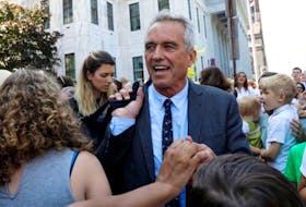 Attorney Robert F. Kennedy Jr. is surrounded by supporters as he departs New York State Supreme Court after a hearing challenging the constitutionality of the NY State Legislature's repeal of the religious exemption to vaccination in Albany, New York, U.S., August 14, 2019.