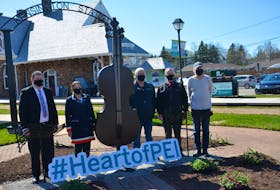 A nine-foot-high fiddle and two music notes were unveiled near the entrance of the Kensington Railyards on May 14. From left: Minister of Economic Growth, Tourism and Culture Matthew MacKay, the MLA for District 20 Kensington Malpeque; Chief Darlene Bernard of the Lennox Island First Nation; Eric Schurman of Malpeque Fine Iron Products, which created the fiddle and music notes; Kensington Mayor Rowan Caseley, and Don Quarles, chair of the Heart of P.E.I.