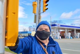 Louise Gillis, who is the national president of the Canadian Council of the Blind, prepares to cross a busy intersection in Sydney on her way to the grocery store. A former nurse, Gillis was left blind after suffering a sudden blood clot in her retinal vein in 1997. Chris Connors • Cape Breton Post