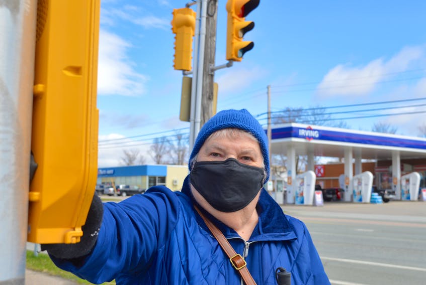 Louise Gillis, who is the national president of the Canadian Council of the Blind, prepares to cross a busy intersection in Sydney on her way to the grocery store. A former nurse, Gillis was left blind after suffering a sudden blood clot in her retinal vein in 1997. Chris Connors • Cape Breton Post
