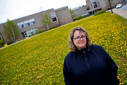 Stacey Rudderham is seen in front of Lockview High in Fall River on Wednesday May 19, 2021. She's worried that the quality of education will decline in Nova Scotia schools amid changes in schedule policy and staffing. - Tim Krochak