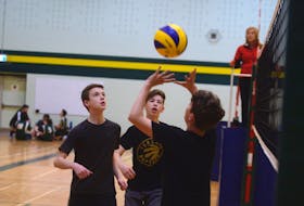 Members of the Charlottetown Capitals wait as teammate sets the ball recently during Volleyball P.E.I. 14-and-under boys spring league action recently at Birchwood Intermediate School in Charlottetown.