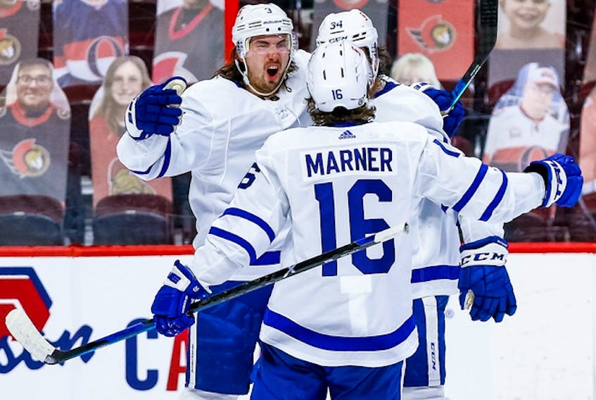 Maple Leafs defenceman Justin Holl (left), who has 19 points in 51 games, took a puck to the mouth midway through the third period of Toronto's  win over Vancouver on Saturday and did not return. He did not practise on Sunday. 