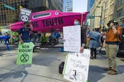  Several dozen supporters of the environmental group Extinction Rebellion occupy the intersection of Granville and Georgia streets in Vancouver, B.C. Saturday, May 1, 2021. The event kicks-off five days of ‘Spring Rebellion’ by the group who are calling for changes to society’s attitudes toward the environment.