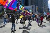  Several dozen supporters of the environmental group Extinction Rebellion occupy the intersection of Granville and Georgia streets in Vancouver Saturday, May 1, 2021.