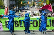Several dozen supporters of the environmental group Extinction Rebellion occupy the intersection of Granville and Georgia Streets in Vancouver, B.C. Saturday, May 1, 2021. The event kicks-off five days of 'Spring Rebellion' by the group who are calling for changes to society's attitudes toward the environment.