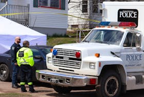 A coroner's vehicle was present at the scene of a suspicious death in Charlottetown on Sunday afternoon along with a forensics unit. 