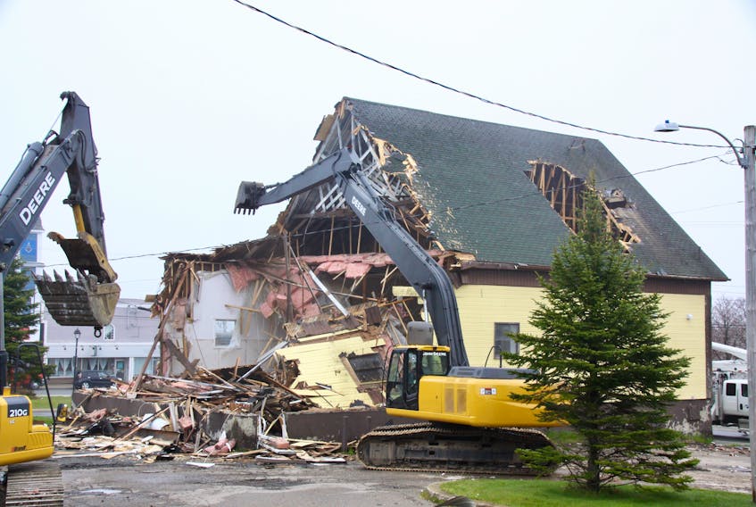 Crews demolished St. Mary's Parish Hall in Glace Bay on Wednesday. Rev. Dorothy Miller, who presides over St. Mary's and other churches in the Collieries Parish group, posted the photo on Facebook and explained costs for renovations and updates were too much. "As we watch the demolition of St. Mary's Parish Hall we remember and give thanks for the memories. We now open up new space and look forward to new opportunities to work in partnership with other groups in our community." The hall was built in 1941. CONTRIBUTED 