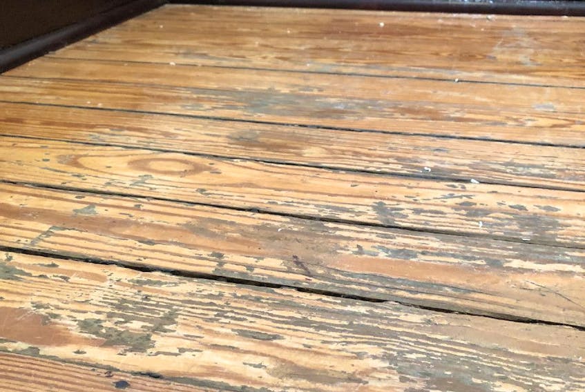  If your wood floor looks like this, sanding all the way back to bare wood is the first step to making the wood look nice again.
