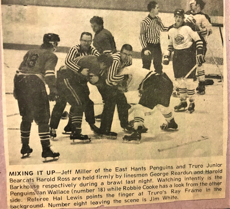 A close-up of the Truro Daily News photo Harold Barkhouse is looking at; a picture of him in action as a young linesman. - FILE  photo