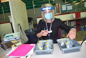 Bonnie Maxwell, a clinic team lead for Public Health, with Pfizer vaccine at the vaccination site at the Canada Games Complex at Cape Breton University. Sharon Montgomery-Dupe/Cape Breton Post