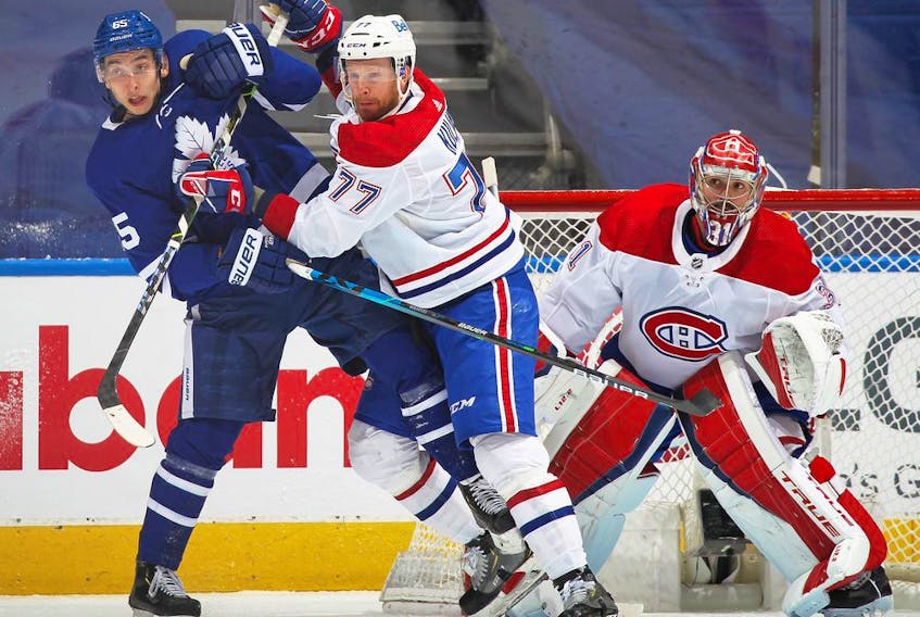 Canadiens' Brett Kulak (77) battles Maple Leafs'  Ilya Mikheyev in Game 2 of the first round of the 2021 Stanley Cup Playoffs at Scotiabank Arena on Saturday, May 22, 2021, in Toronto.