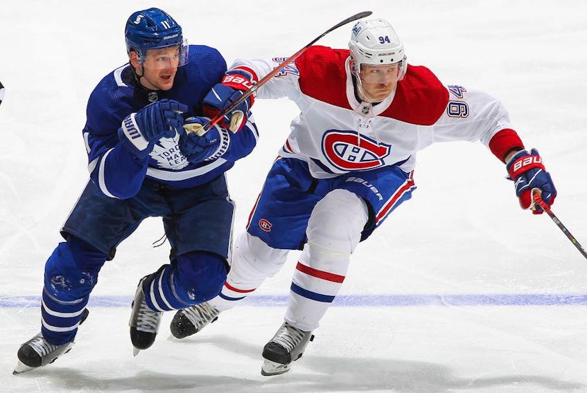 Canadiens' Corey Perry battles against Zach Hyman of the Toronto Maple Leafs in Game 2 of the first round of the 2021 Stanley Cup Playoffs at Scotiabank Arena on Saturday, May 22, 2021, in Toronto.