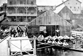 The internationally famous oarsmen known as the Pryor Crew, all seated in shell, at the Royal Halifax Yacht Club, then located on the Halifax waterfront, in an area which is now part of the Halifax Shipyards. August 1871. - Nova Scotia 