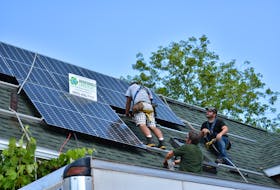 A crew from Renewable Lifestyles install solar panels on the roof of a Charlottetown home in August 2020. With new funding, residents in Charlottetown, Stratford and Wolfville, N.S., can have the upfront costs for energy-efficient retrofits like this covered by their municipality.